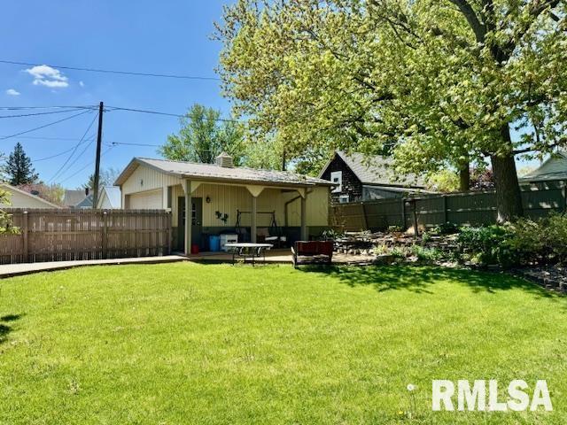 back of property with a patio and a chimney