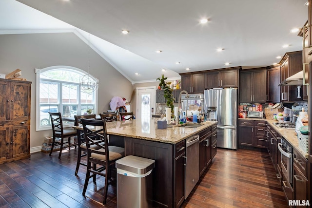17503 N Woodlawn Ln, Woodlawn, IL 62898 - kitchen with appliances with stainless steel finishes, crown molding, dark brown cabinets, light stone countertops, and dark wood-style floors