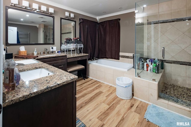 17503 N Woodlawn Ln, Woodlawn, IL 62898 - full bathroom featuring a stall shower, wood finished floors, a garden tub, vanity, and crown molding