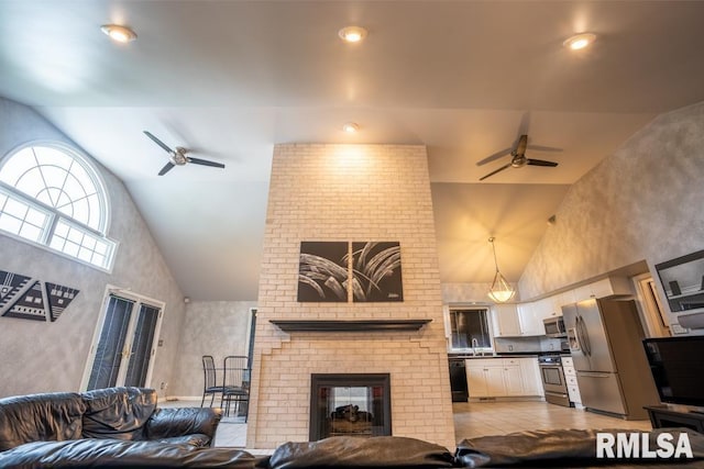 12 Old Marion Rd, West Frankfort, IL 62896 - living room with a ceiling fan, a fireplace, and high vaulted ceiling