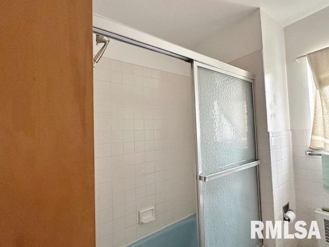 full bathroom featuring shower / bath combination with glass door