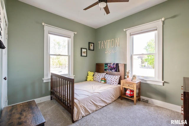 bedroom featuring carpet flooring, baseboards, and a ceiling fan