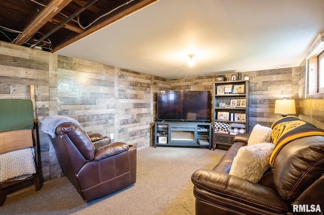 living area featuring wooden walls and carpet floors