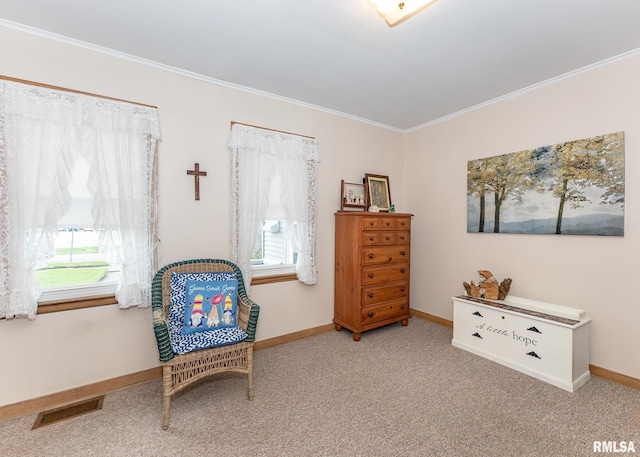sitting room with healthy amount of natural light, ornamental molding, baseboards, and carpet floors