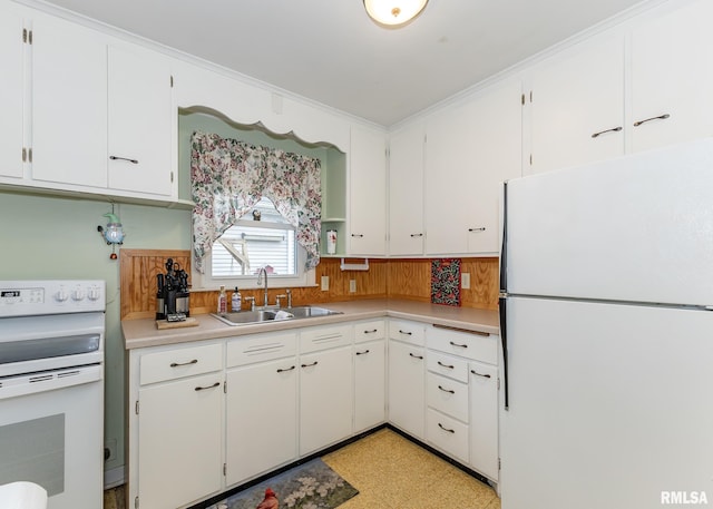 kitchen with white appliances, a sink, light floors, white cabinets, and light countertops