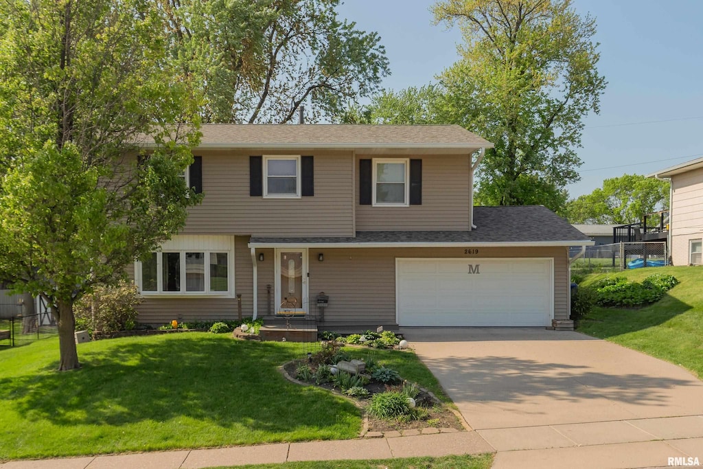 2619 W 37th St, Davenport, IA 52806 - view of front of house featuring concrete driveway and a shingled roof