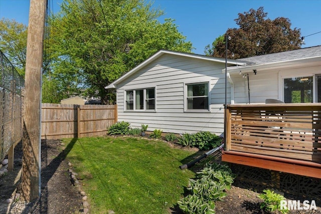 view of side of home with a deck