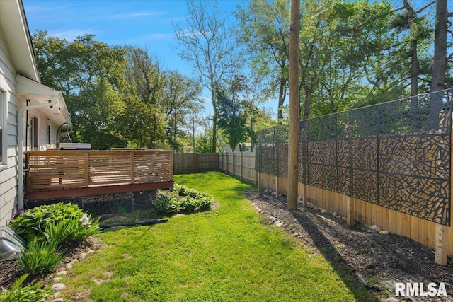 view of yard featuring a wooden deck
