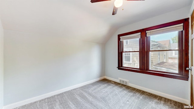 2117 Harrison St, Davenport, IA 52803 - additional living space featuring vaulted ceiling, baseboards, carpet floors, and a ceiling fan