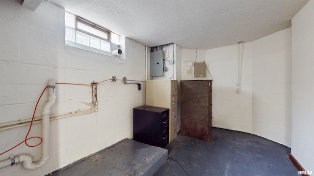 2117 Harrison St, Davenport, IA 52803 - basement with a textured ceiling, concrete block wall, and electric panel