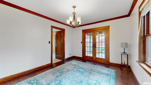2117 Harrison St, Davenport, IA 52803 - unfurnished room with french doors, wood finished floors, a chandelier, baseboards, and ornamental molding