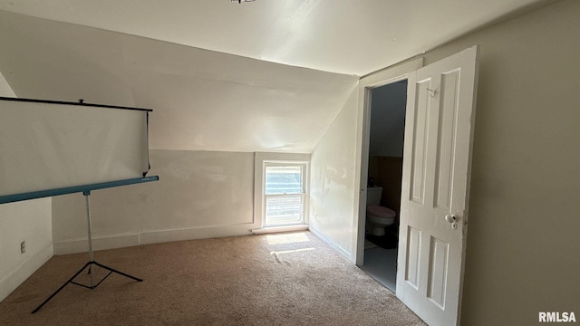 bonus room featuring carpet and vaulted ceiling