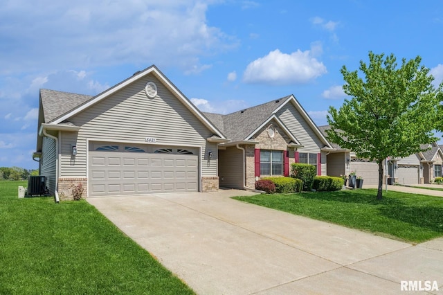 view of front of home with a garage, driveway, brick siding, central AC, and a front lawn