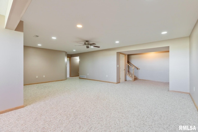 finished below grade area featuring baseboards, recessed lighting, stairs, carpet, and ceiling fan