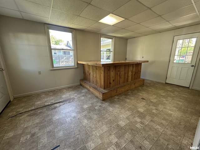 812 E Murray St, Macomb, IL 61455 - indoor dry bar featuring baseboards and a paneled ceiling