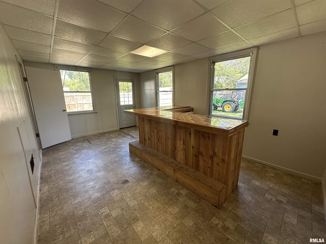 812 E Murray St, Macomb, IL 61455 - misc room with a paneled ceiling, baseboards, and a dry bar