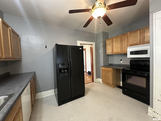 812 E Murray St, Macomb, IL 61455 - kitchen featuring black appliances, dark countertops, baseboards, ceiling fan, and a sink