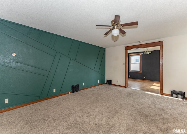 1010 S 6th St, Clinton, IA 52732 - empty room with light carpet, a ceiling fan, and a textured ceiling