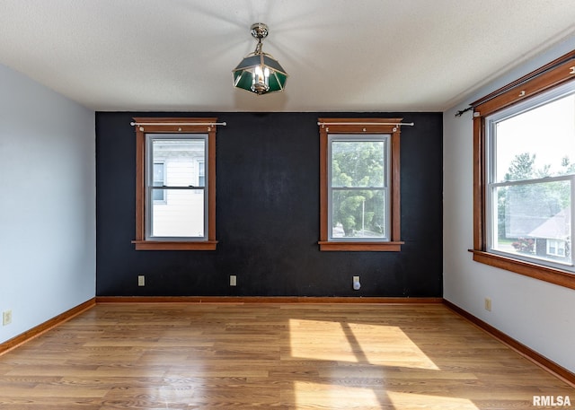 1010 S 6th St, Clinton, IA 52732 - unfurnished room featuring wood finished floors and baseboards