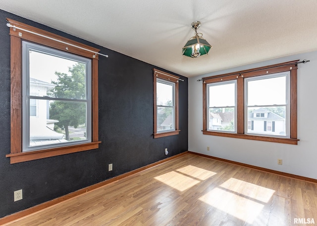 1010 S 6th St, Clinton, IA 52732 - empty room with light wood-style floors and plenty of natural light