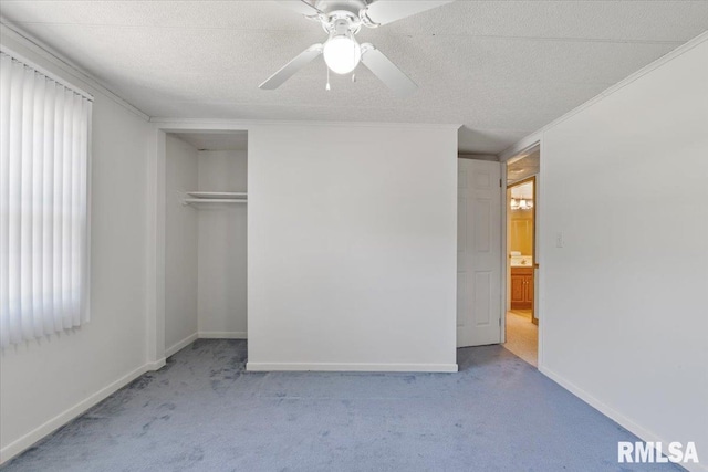 unfurnished bedroom with carpet, baseboards, a closet, a ceiling fan, and ornamental molding