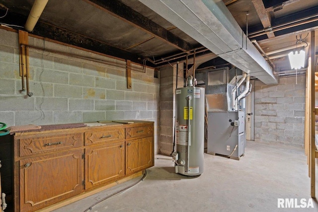 unfinished basement featuring gas water heater and heating unit