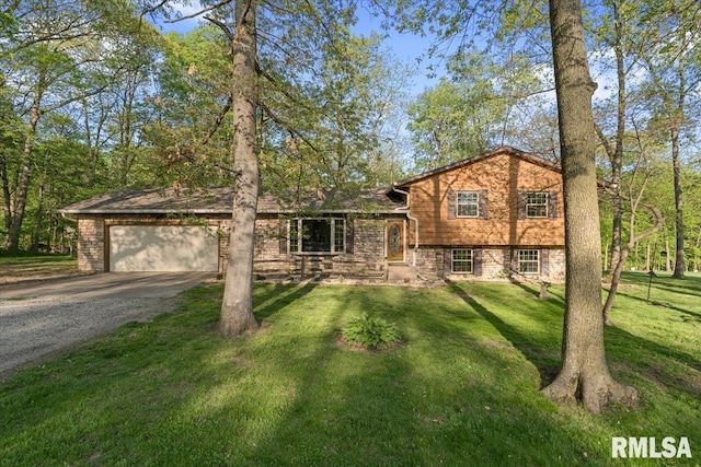 1401 265th St, Sherrard, IL 61281 - tri-level home featuring gravel driveway, an attached garage, and a front yard