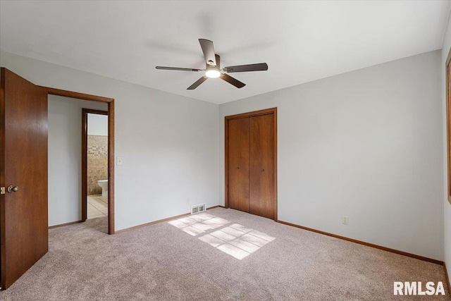 1401 265th St, Sherrard, IL 61281 - unfurnished bedroom featuring light carpet, a closet, baseboards, and ceiling fan