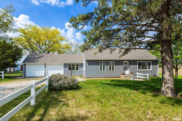 13218 300th St, Donahue, IA 52746 - ranch-style home with a garage and driveway