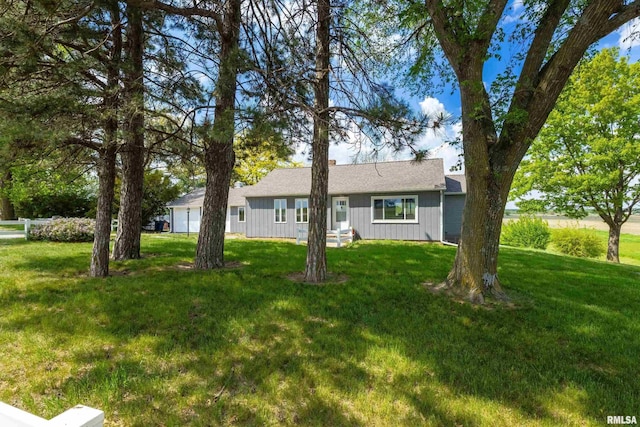 13218 300th St, Donahue, IA 52746 - view of front of home featuring a garage and a front yard