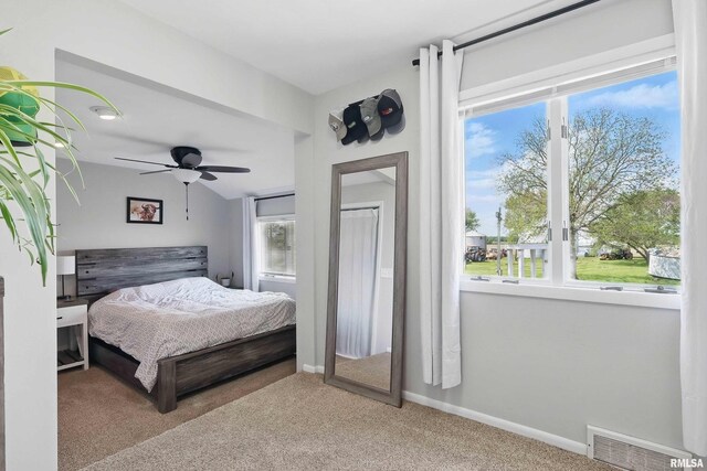 13218 300th St, Donahue, IA 52746 - carpeted bedroom featuring baseboards and ceiling fan