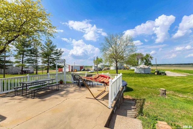 13218 300th St, Donahue, IA 52746 - view of patio / terrace with outdoor dining area and a pergola