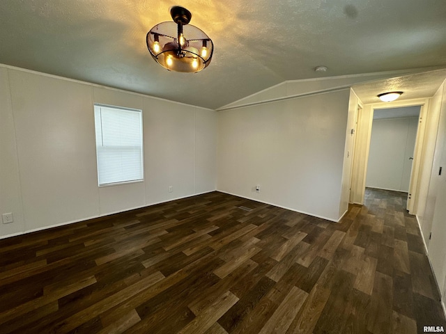 806 Boyd St, Eldorado, IL 62930 - unfurnished room featuring dark wood-type flooring, lofted ceiling, a chandelier, a textured ceiling, and a smoke detector