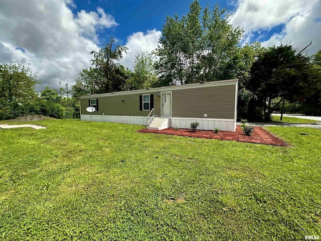 806 Boyd St, Eldorado, IL 62930 - back of property with entry steps, a lawn, and view of scattered trees