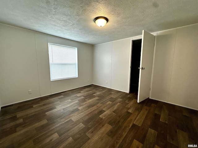 806 Boyd St, Eldorado, IL 62930 - unfurnished room with dark wood finished floors and a textured ceiling
