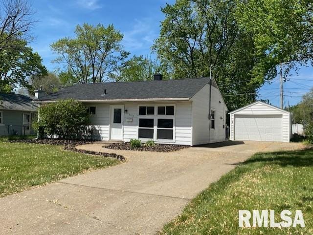 2712 30th St, Rock Island, IL 61201 - ranch-style home featuring a garage, an outbuilding, and a front lawn