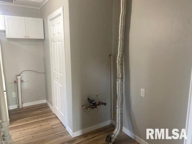 2712 30th St, Rock Island, IL 61201 - hallway featuring light wood-type flooring, baseboards, and crown molding