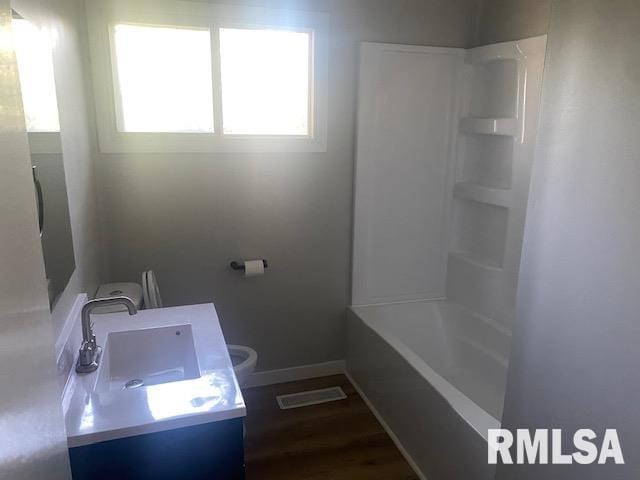 2712 30th St, Rock Island, IL 61201 - bathroom with vanity, toilet, and baseboards