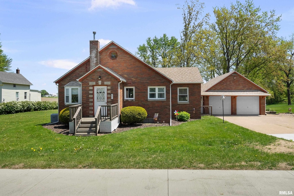 view of front of house featuring a chimney, a front lawn, brick siding, and an outdoor structure