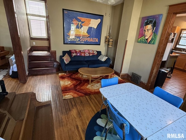 living room with wood finished floors and baseboards