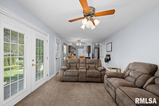 living room with carpet and ceiling fan