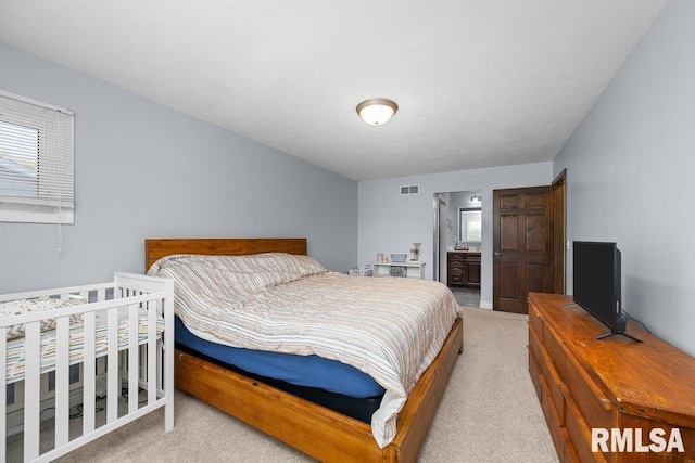 bedroom featuring carpet floors and multiple windows
