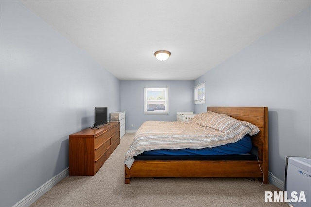 carpeted bedroom with baseboards