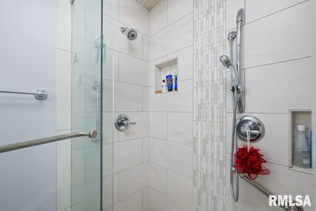 bathroom with a shower stall