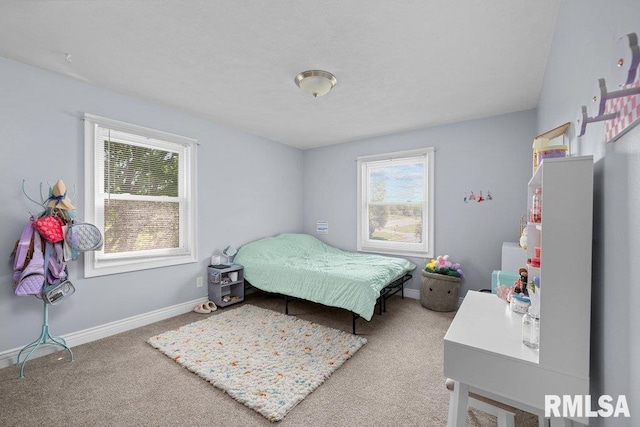 bedroom featuring multiple windows, carpet flooring, and baseboards