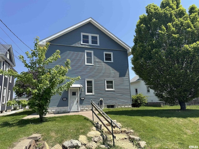 back of house featuring a yard