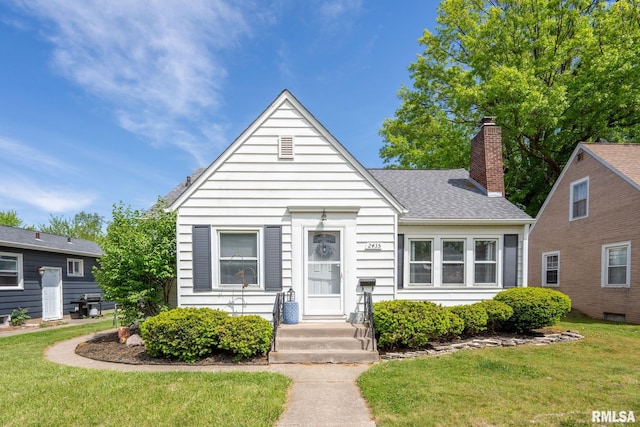 bungalow-style home featuring a front yard, a chimney, and roof with shingles