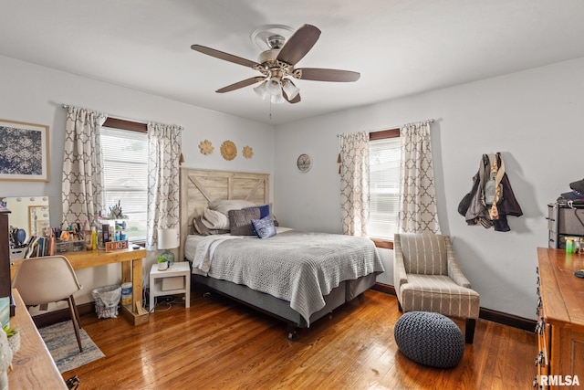 bedroom featuring wood finished floors and ceiling fan