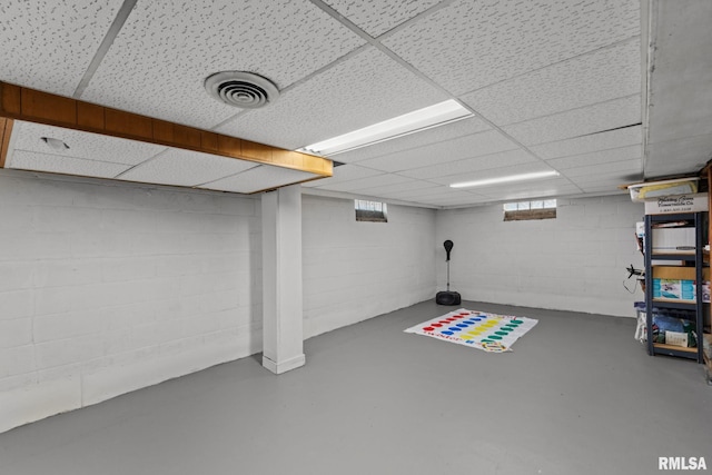 below grade area with a drop ceiling