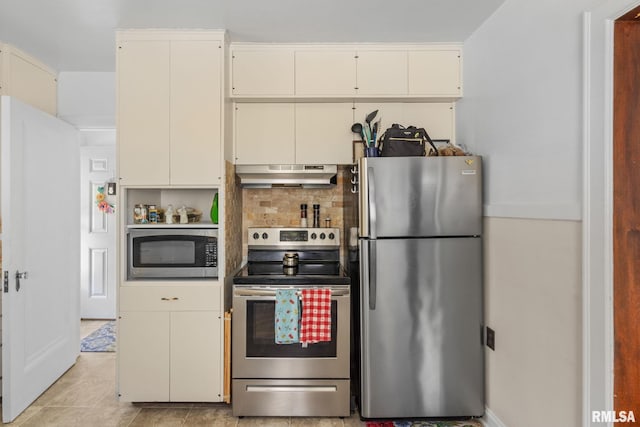kitchen featuring stainless steel appliances, under cabinet range hood, decorative backsplash, and light tile patterned floors